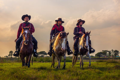 Cowboys riding
