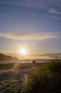 Scenic view of landscape against sky during sunset