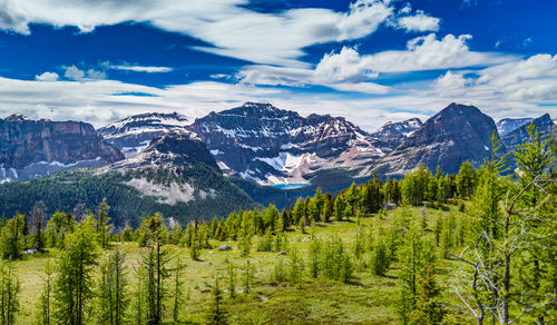 Scenic view of mountains against cloudy sky