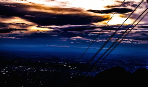 Clouds over city at sunset