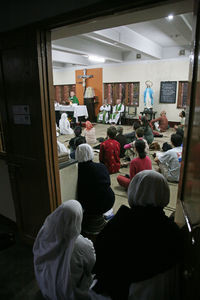 Rear view of people working at railroad station