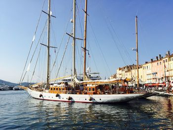 Boats moored at harbor