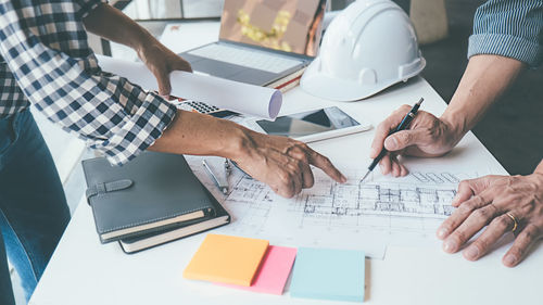 Low angle view of man working on table