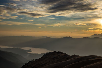 Scenic view of mountains against sky during sunset