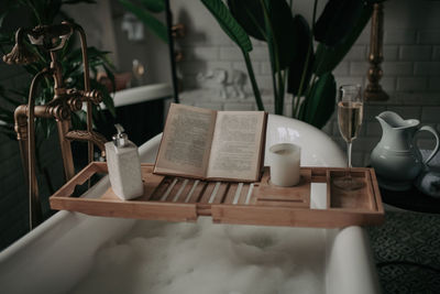 Luxury interior of big bathroom at modern african style with oval bathtub in natural lighting