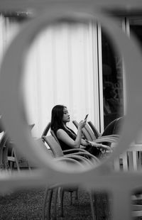 Portrait of woman sitting on chair