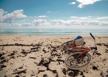 High angle view of bicycle on sandy beach
