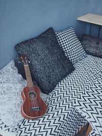 High angle view of guitar at home