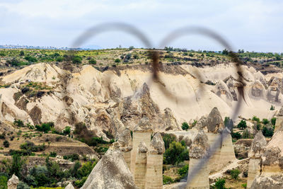 Panoramic view of rock formations against sky