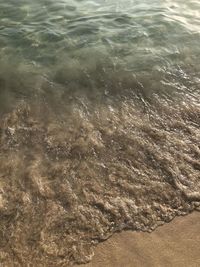 High angle view of surf on beach