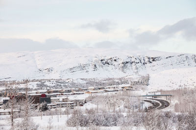 High angle view of snow covered landscape against sky