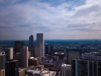 High angle view of buildings in city against sky