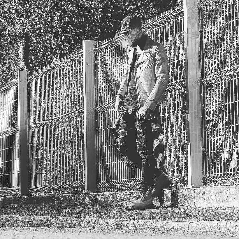 childhood, fence, full length, lifestyles, leisure activity, metal, railing, men, park - man made space, playground, sunlight, boys, shadow, elementary age, chainlink fence, playing, day, casual clothing