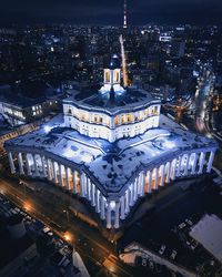 High angle view of illuminated buildings in city at night