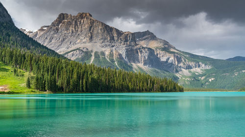 Scenic view of lake and mountains against sky