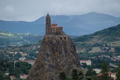 Saint michel daiguilhe chapel at hill top against mountains