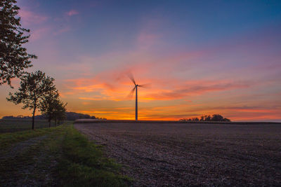 Scenic view of field against sky during sunset