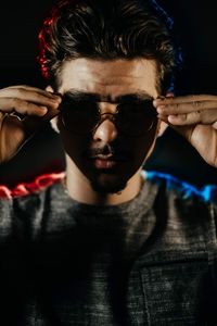 Portrait of young man wearing sunglasses