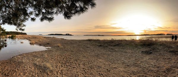 Scenic view of beach against sky during sunset