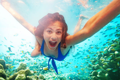 Young woman swimming in sea