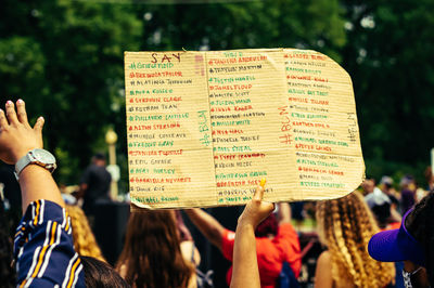 Group of people with text against blurred background