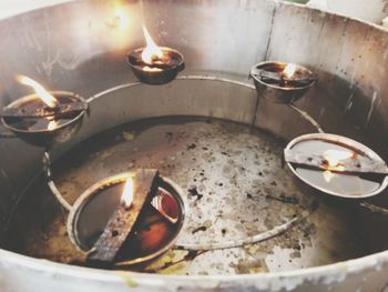 Close-up of illuminated tea light