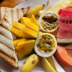 Close-up of foodc and tropical fruits in plate