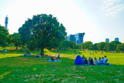 Group of people relaxing in park