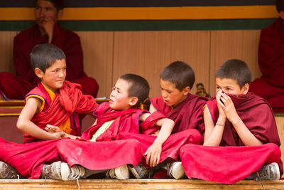 High angle view of people looking at traditional clothing