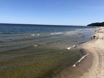 Scenic view of beach against clear sky