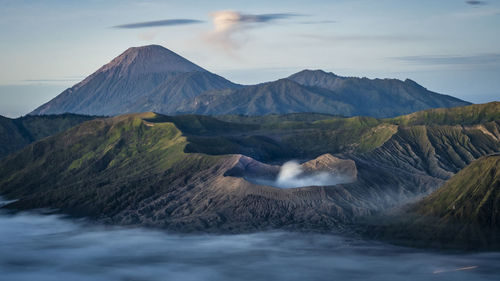 Scenic view of mountains with fog at bromo tengger semeru national park, indonesia
