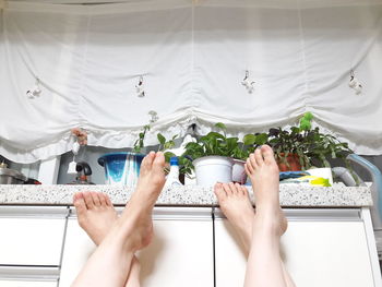 Close-up of woman lying on bed