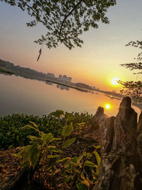 Scenic view of lake against sky during sunset