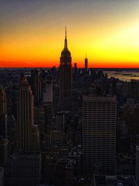 Modern buildings in city during sunset