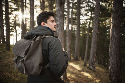 Man with backpack at forest