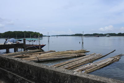 Pier over lake against sky