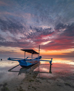 Scenic view of beach against sky during sunset