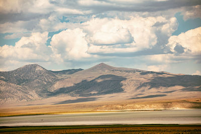 Scenic view of landscape and mountains against sky