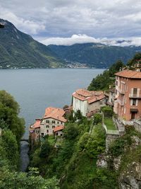 High angle view of townscape by mountains against sky