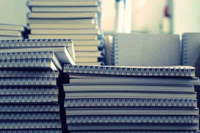 Close-up of stacked books on table