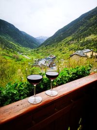 Green table and mountains against sky