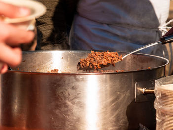 Midsection of person preparing food