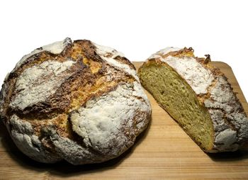 High angle view of bread on table against white background