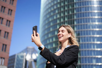 Businesswoman using mobile phone