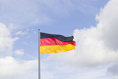 Low angle view of flag against sky, germany flag