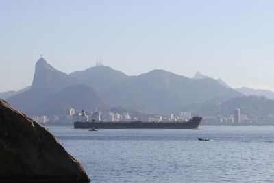 Scenic view of sea with mountains in background