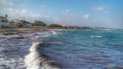 Scenic view of sea against cloudy sky