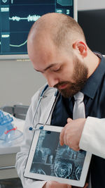 Portrait of young man working in office