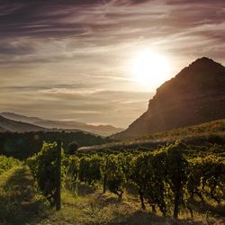 Scenic view of mountains against sky at sunset