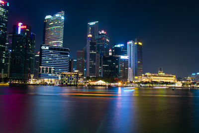 Illuminated buildings in city at night